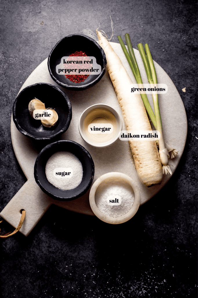 Ingredients for daikon radish salad labeled on tray. 