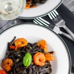 Squid Ink Pasta with Shrimp + Cherry Tomatoes platingsandpairings.com
