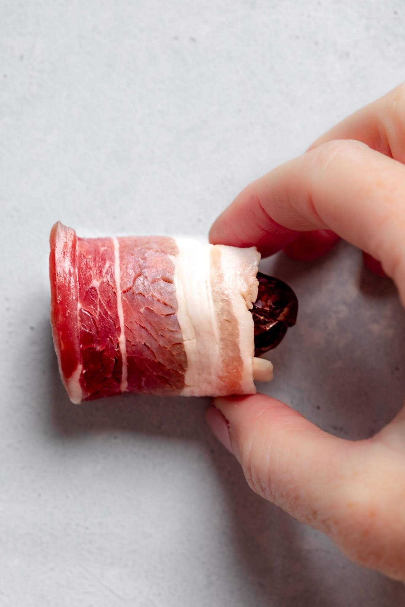 Date wrapped in bacon before baking