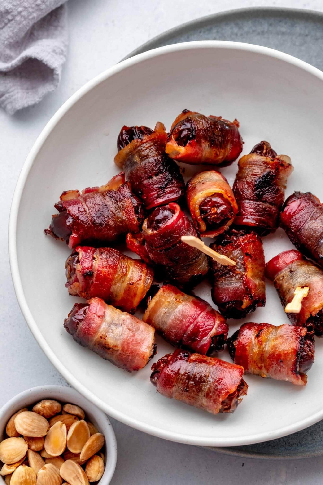 Overhead shot of bacon wrapped dates in bowl. 