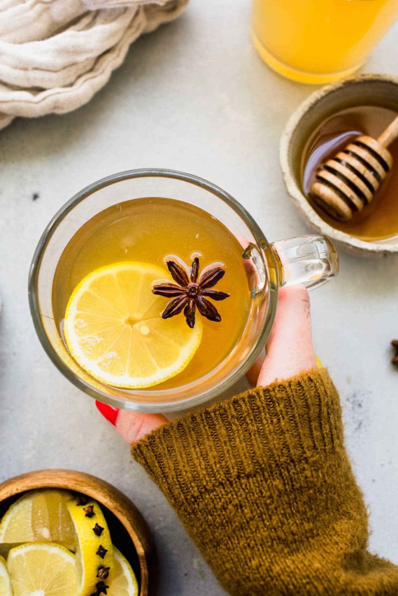 hand holding mug of hot toddy