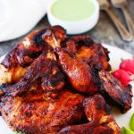 This Peruvian Grilled Chicken with Creamy Green Sauce is packed with flavor and the perfect way to add some international flair to your next barbecue | platingsandpairings.com
