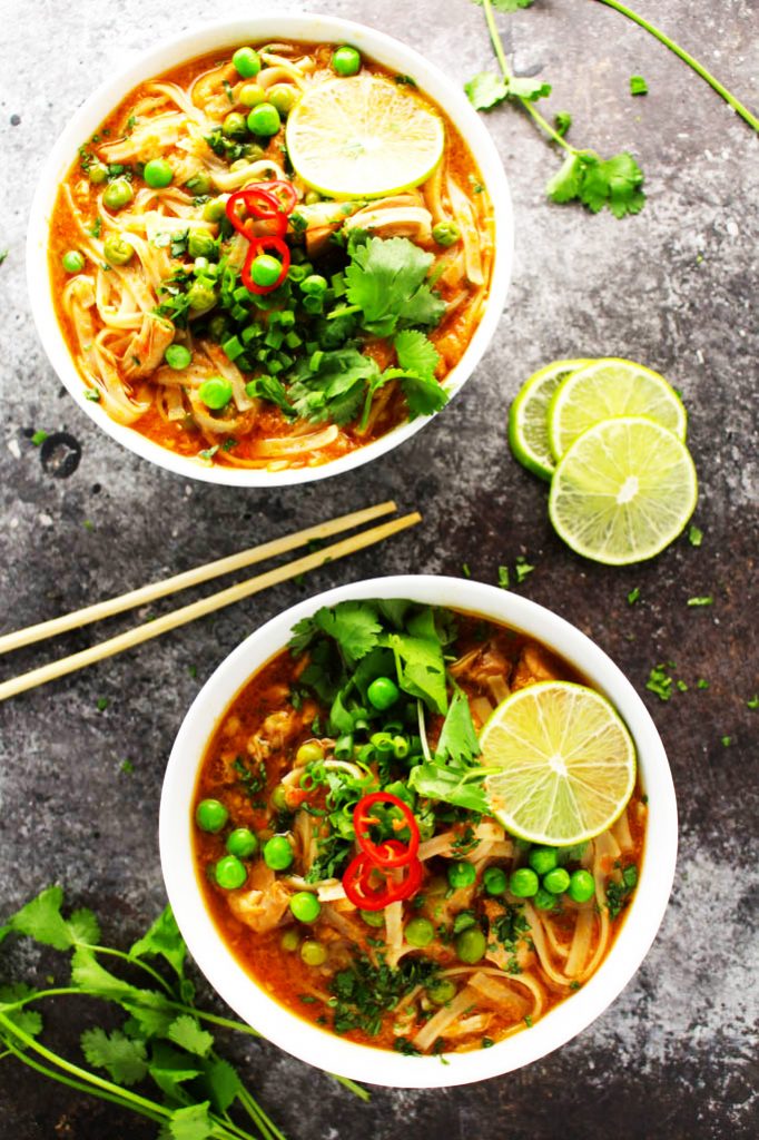 This Easy Slow Cooker Thai Chicken Noodle Soup makes it easy to enjoy your favorite spicy, aromatic, authentic Thai soup at home! | platingsandpairings.com