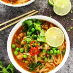 This Easy Slow Cooker Thai Chicken Noodle Soup makes it easy to enjoy your favorite spicy, aromatic, authentic Thai soup at home! | platingsandpairings.com