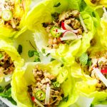 These Larb Gai Thai Lettuce Wraps will have you hooked on their spicy, zesty flavor. Ground chicken combines with plenty of fresh mint, lime juice and lemongrass for a healthy Thai dish that’s perfect for lunch or dinner. | platingsandpairings.com