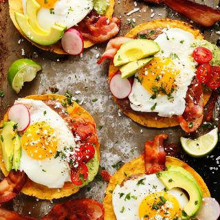 These Bacon Breakfast Tostadas are perfect for serving a group at brunch because everyone can customize their toppings & the style of eggs that they prefer. | platingsandpairings.com