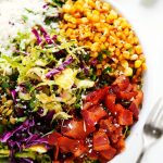 This Shaved Brussels Sprouts Salad with Cumin Lime Vinaigrette has a southwestern kick with cotija cheese, pepitas, roasted corn and bacon. | platingsandpairings.com