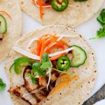 These Banh Mi Pork Tacos are perfect for grilling season and can be made in under 30 minutes! Tender grilled pork is topped with quick-pickled vegetables, hot chili mayo, jalapenos and cilantro. It’s your favorite sandwich, in taco form! | platinigsandpairings.com