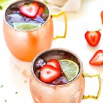 Try this Strawberry Lime Moscow Mule for a twist on the traditional Moscow Mule cocktail. Fresh strawberries, lime juice, vodka and ginger beer combine together in this delicious and refreshing icy cocktail. | platingsandpairings.com