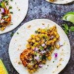 These Mexican Street Corn Chicken Tacos put a fun twist on elotes or grilled Mexican corn on the cob that's slathered in a tangy cream sauce and sprinkled with chili powder. Plus, they come together in just 20 minutes! | platingsandpairings.com