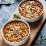 This Instant Pot recipe for Cheesy Southwestern Lentils & Brown Rice is the perfect quick vegetarian weeknight dinner recipe that's perfect for Meatless Monday! Hearty lentils and brown rice combine with southwestern spices, tomatoes, peppers & plenty of melty cheese! | platingsandpairings.com