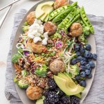 This Turkey Meatball Chopped Salad is loaded with veggies and topped with grilled fresh blackberries, blueberries, avocado and goat cheese. | platingsandpairings.com