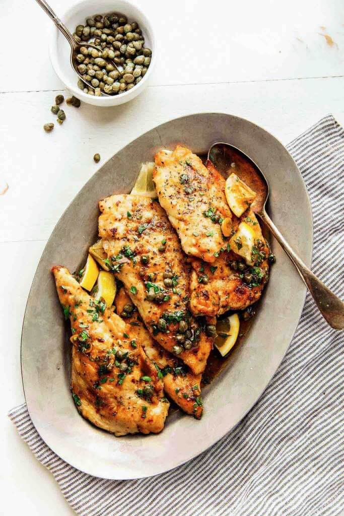 30 Minute Easy Chicken Piccata is perfect for a quick weeknight dinner. The lemon-garlic, butter caper sauce will have you licking your plate. | platingsandpairings.com
