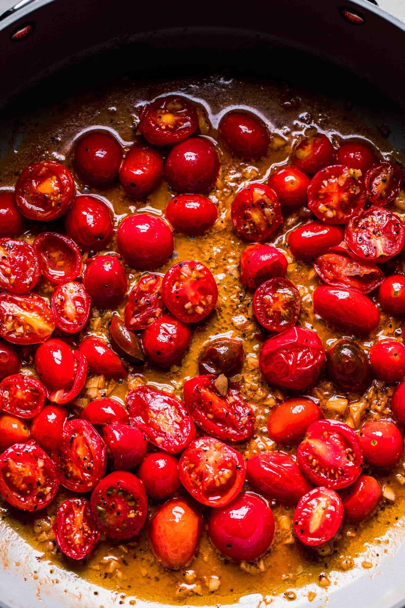 Softened tomatoes in skillet. 
