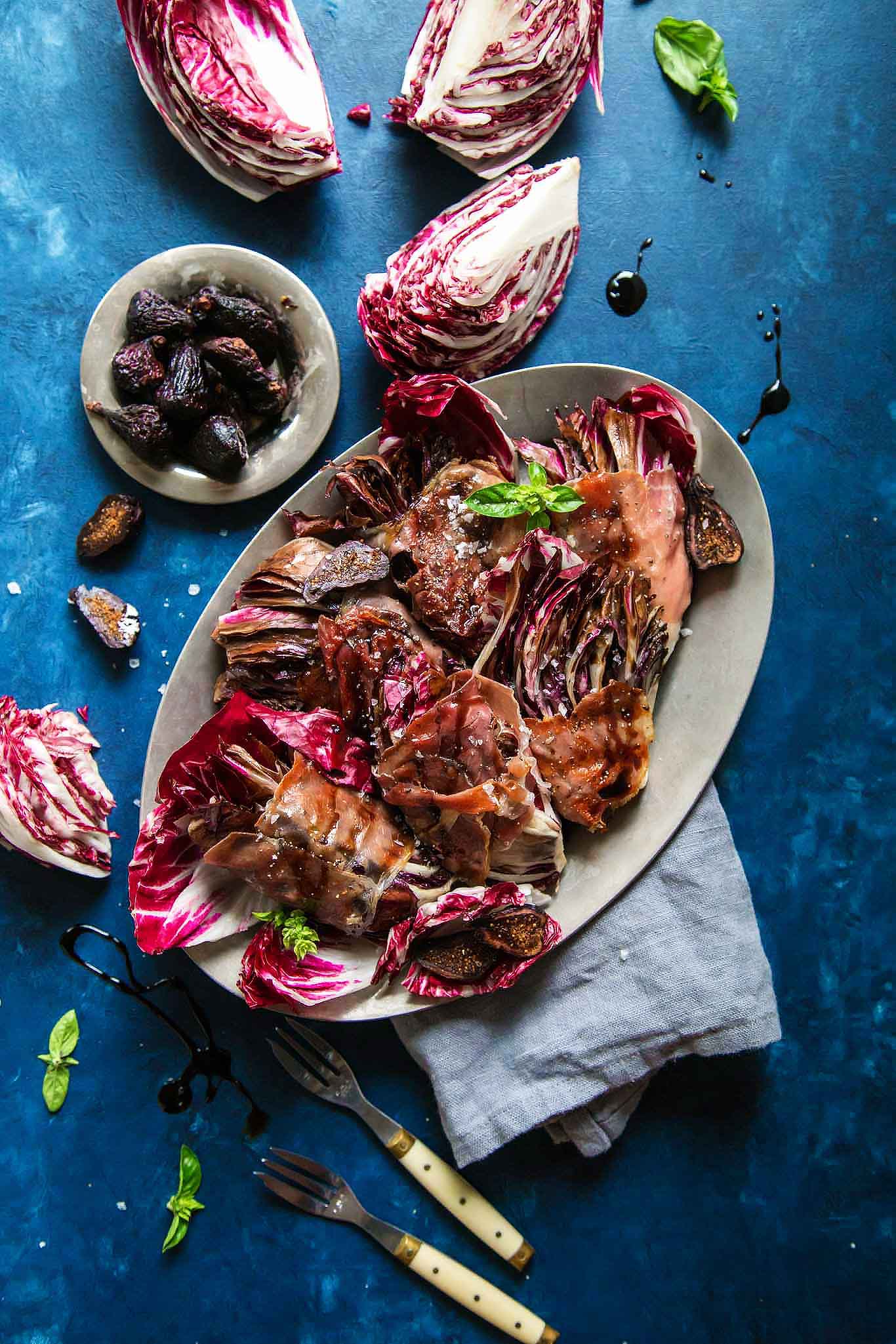 Up close platter of grilled radicchio with balsamic glaze.