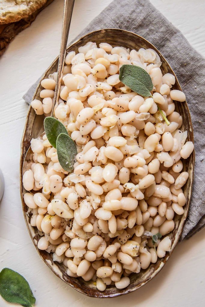 Overhead shot of Italian White Beans on white background