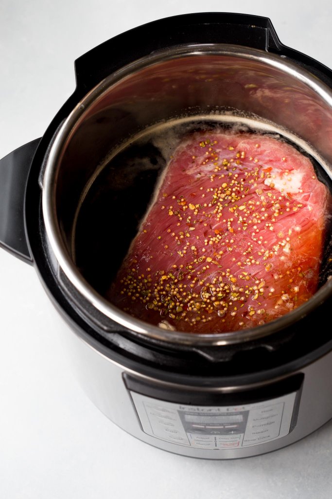 This Instant Pot Corned Beef & Cabbage is made with the help of your electric pressure cooker and finished off under the broiler with a honey-dijon glaze, giving it a perfectly crispy exterior. 