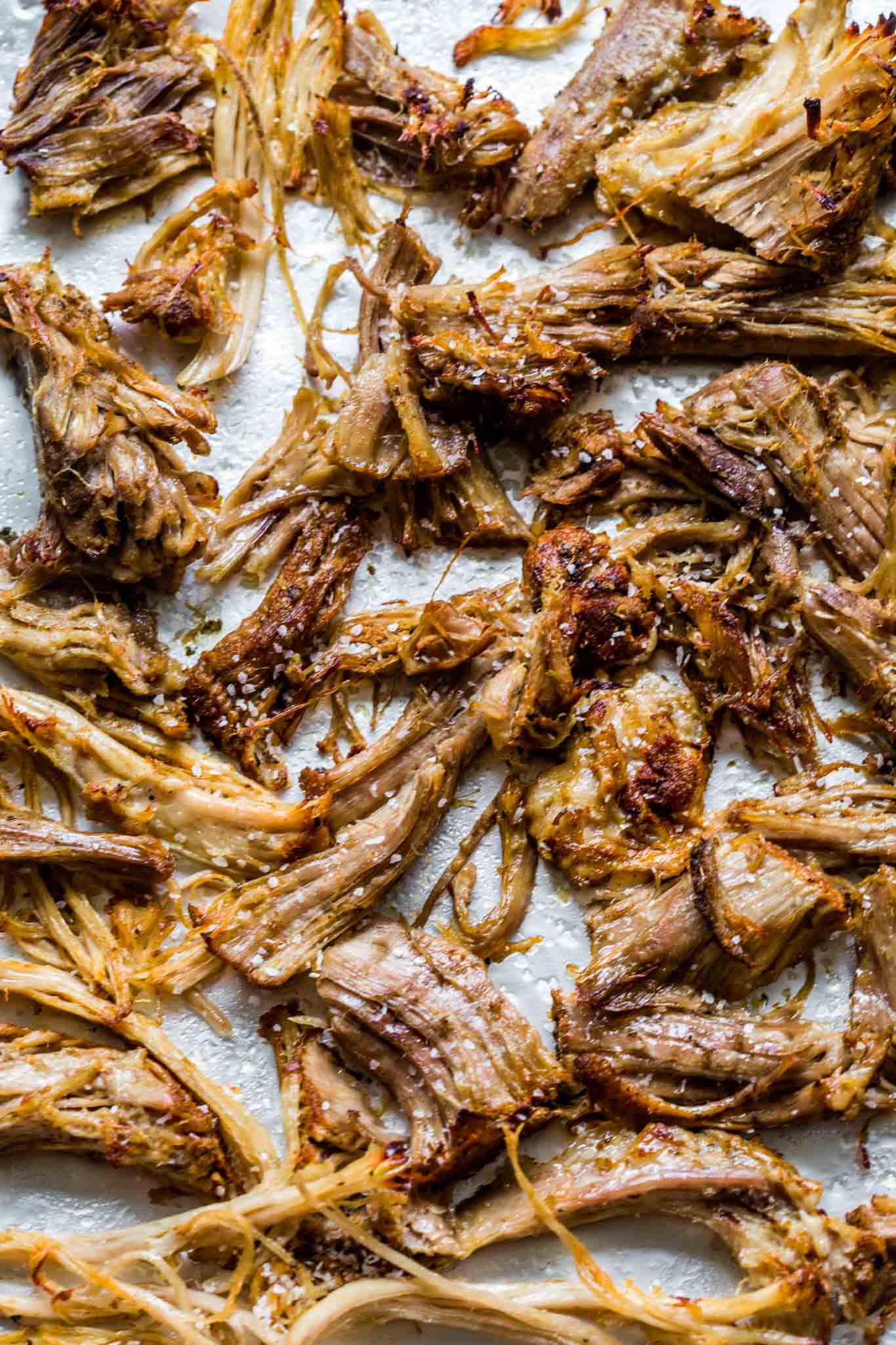 Crispy carnitas on a baking sheet.