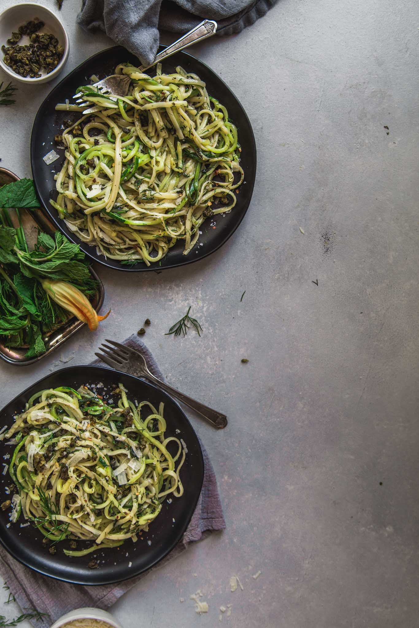 Two plates of zucchini noodles