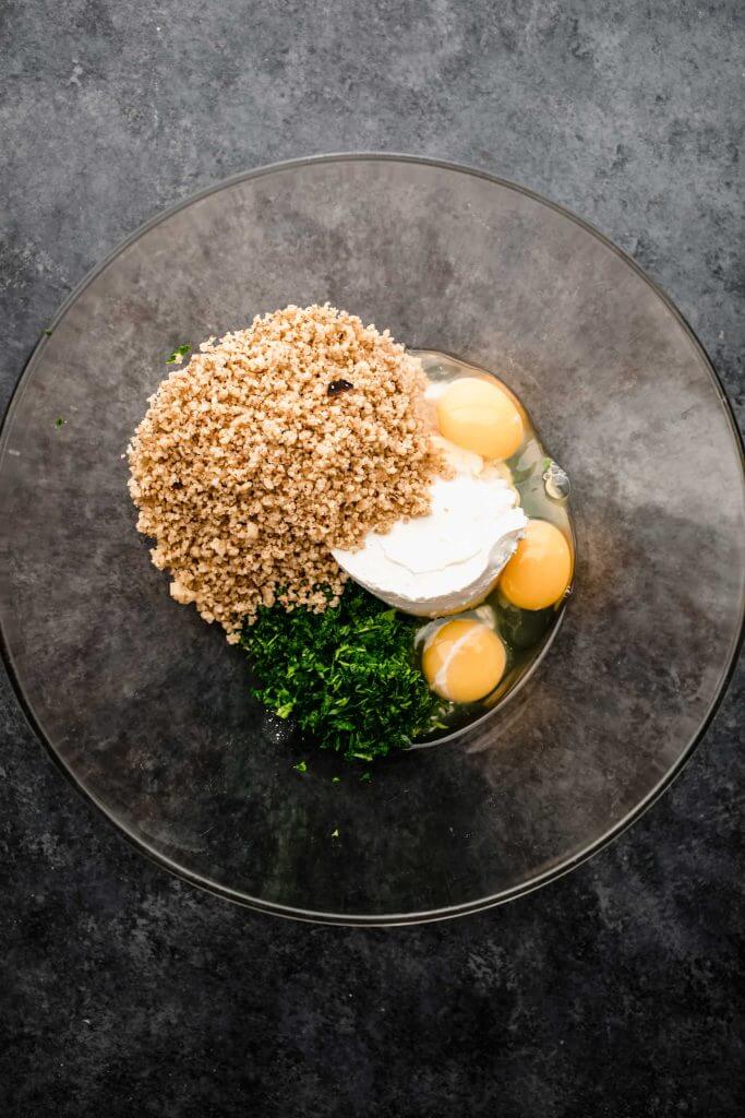 Eggs and walnuts in food processor.