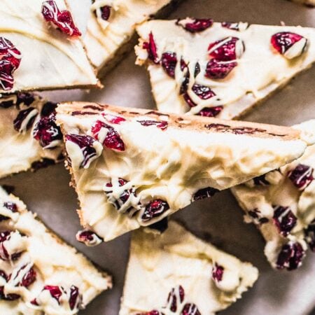 Close up of cranberry bliss bars on serving tray.