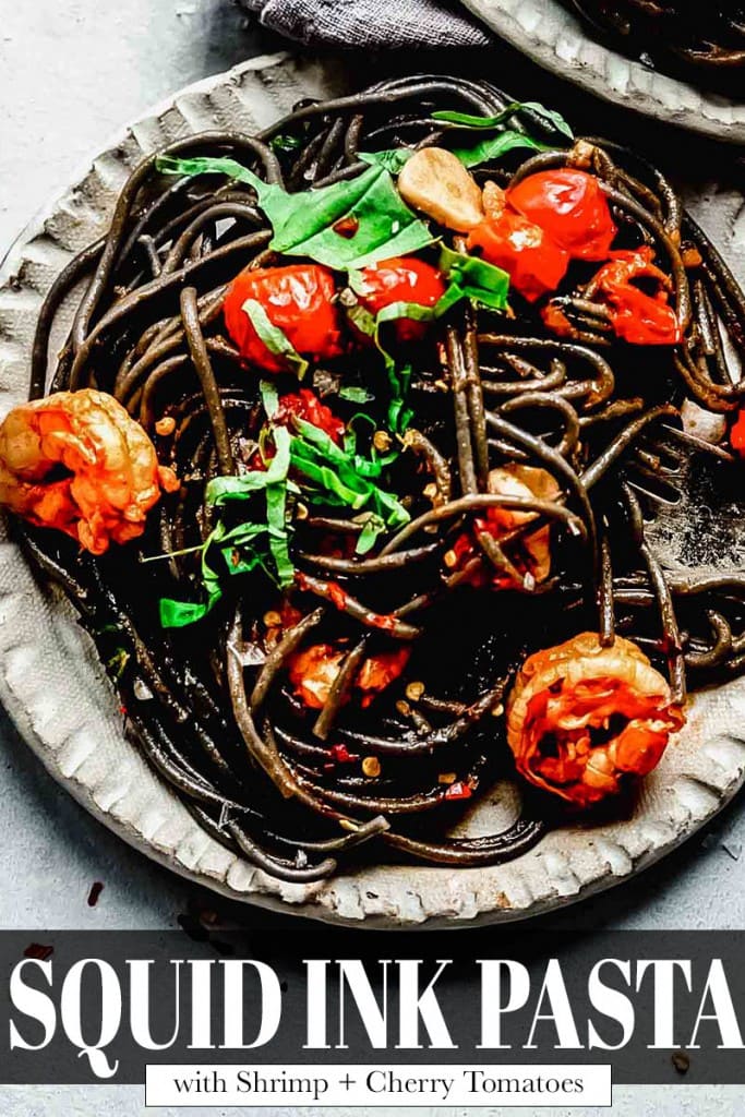 Overhead close up of plate of squid ink pasta.