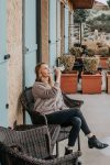 Erin drinking wine on patio at Black Walnut Inn