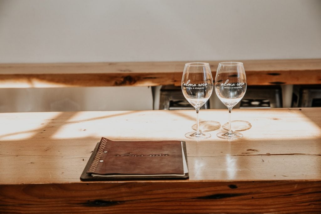 Two wine glasses at Alma Rosa tasting room.