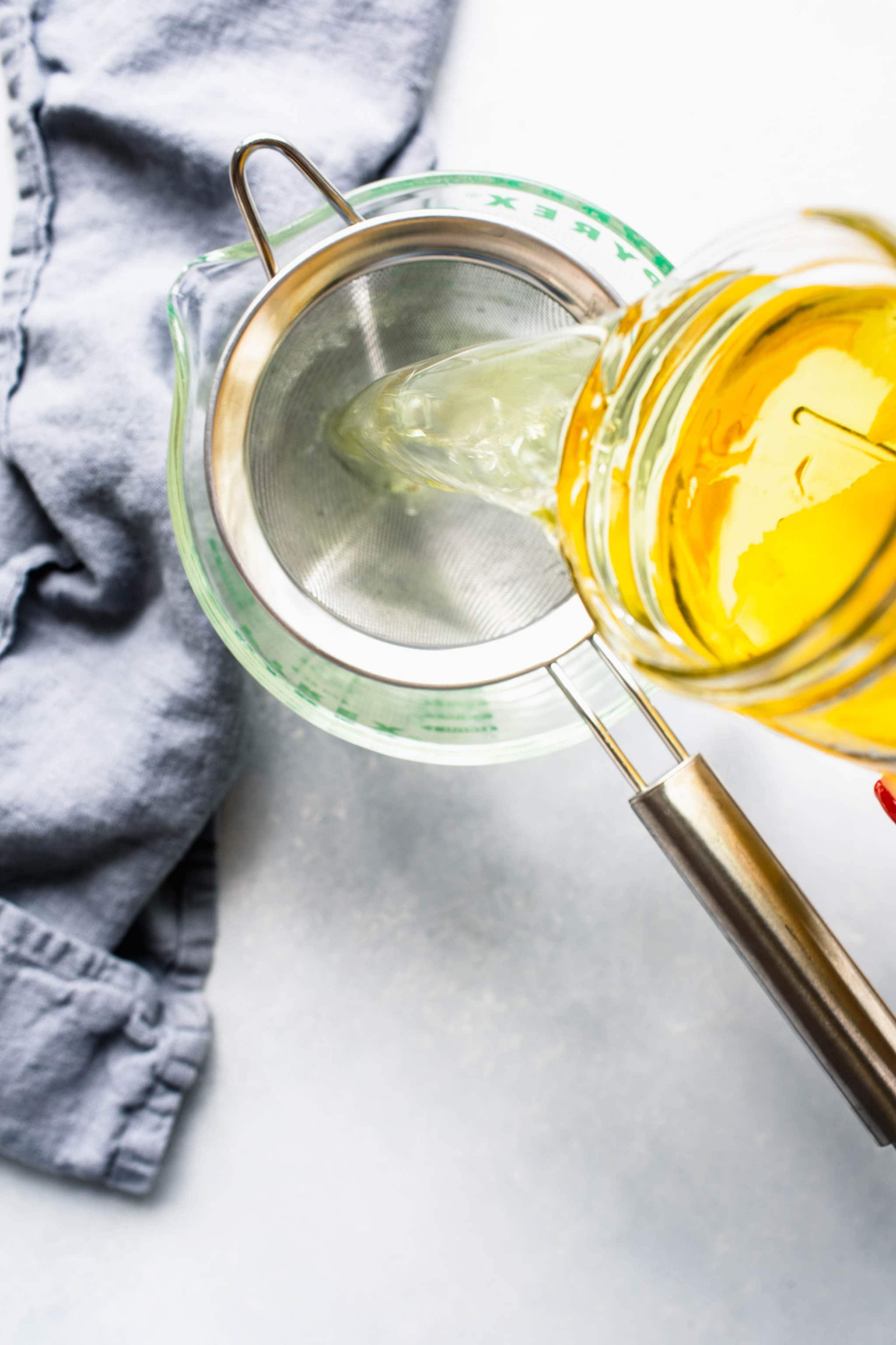 Limoncello being strained.