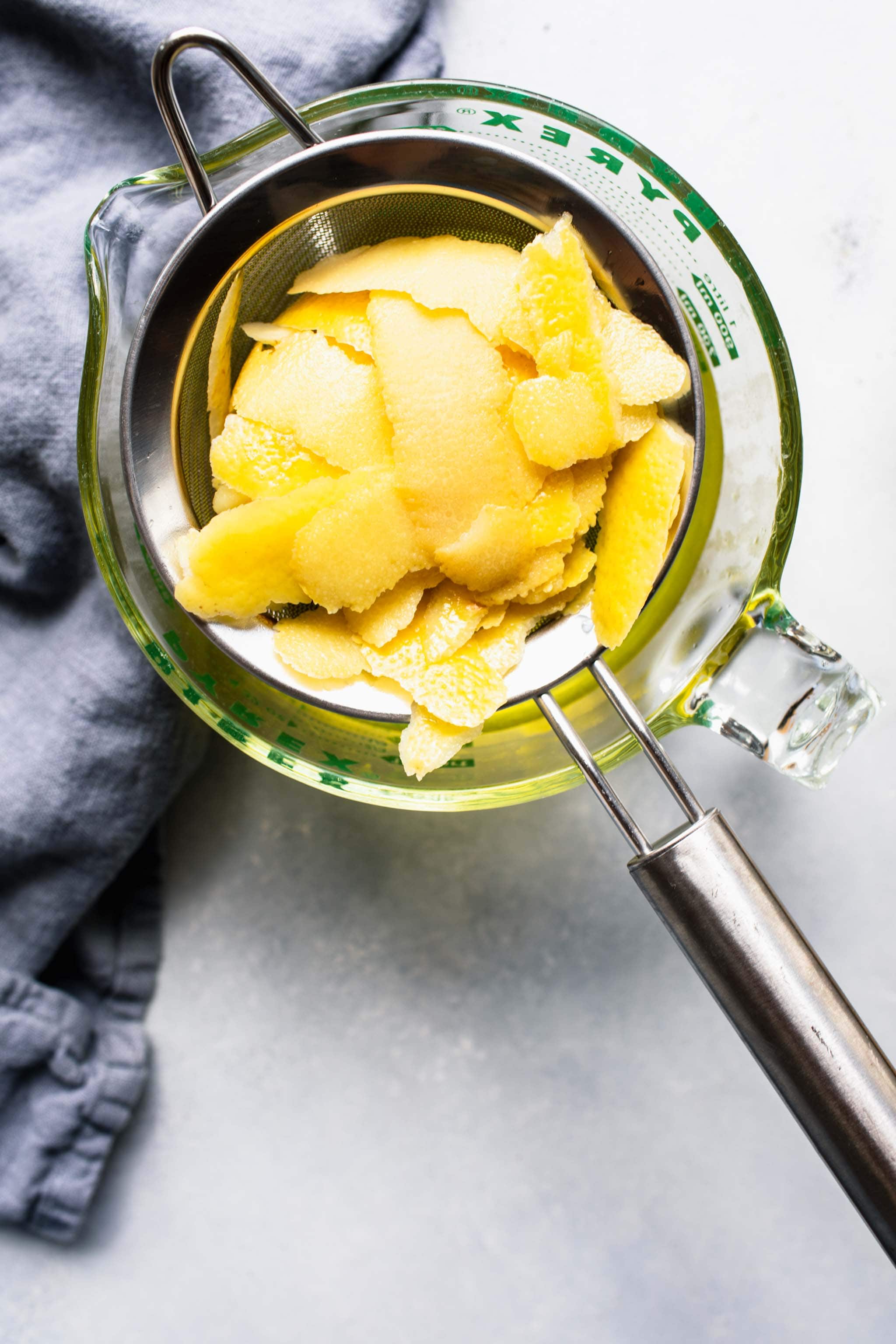 Lemon peels in strainer.