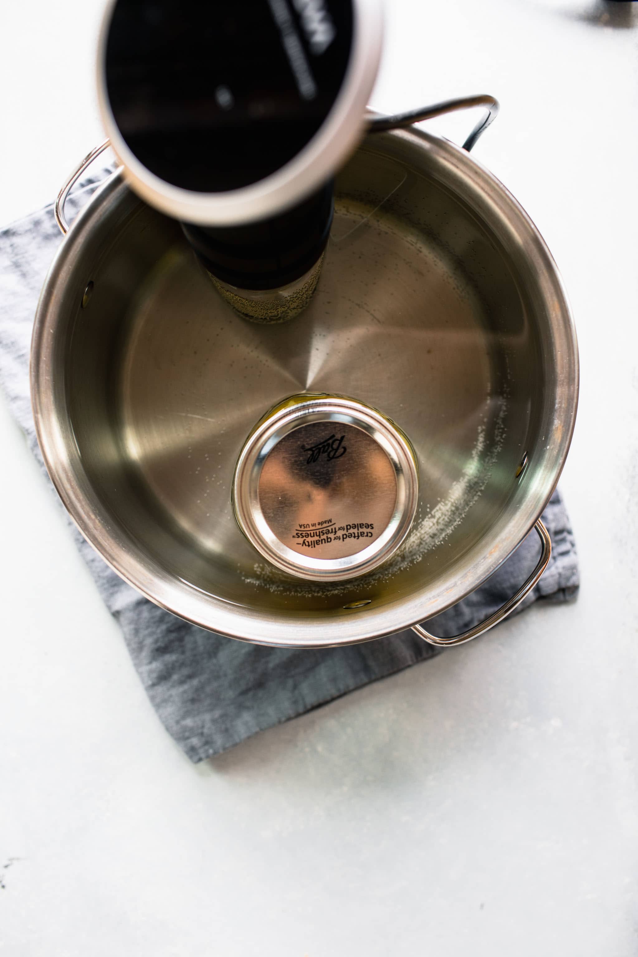 Mason jar in sous vide water bath.