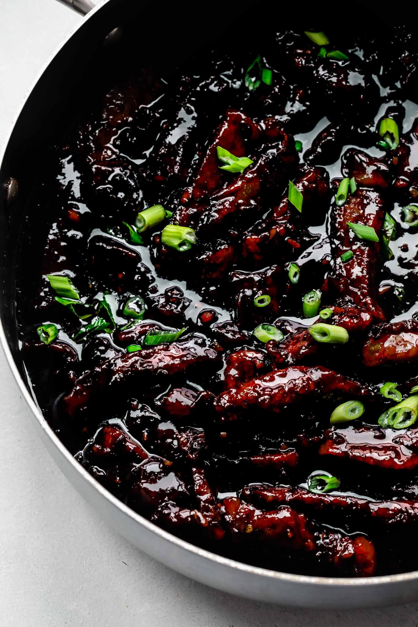 Cooked mongolian beef in large skillet.