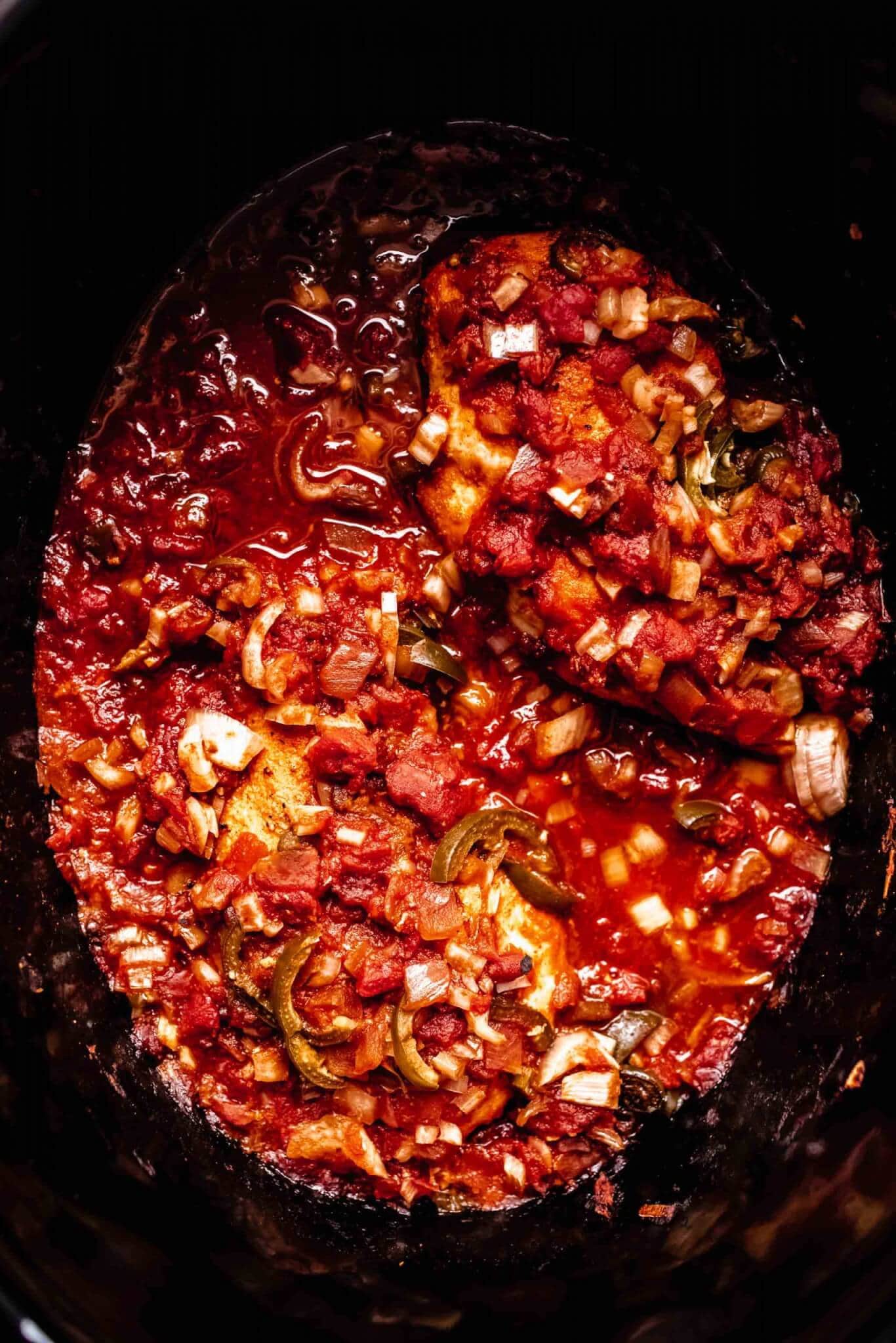 Cooked slow cooker salsa chicken in crockpot.