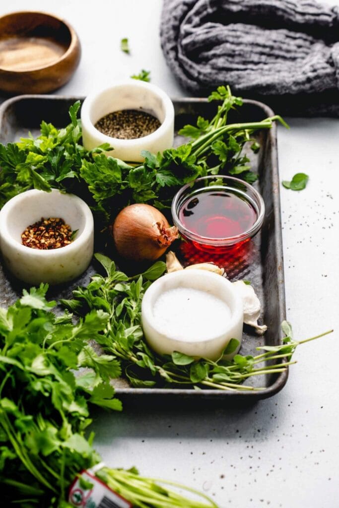 Ingredients for chimichurri sauce for pork on counter.