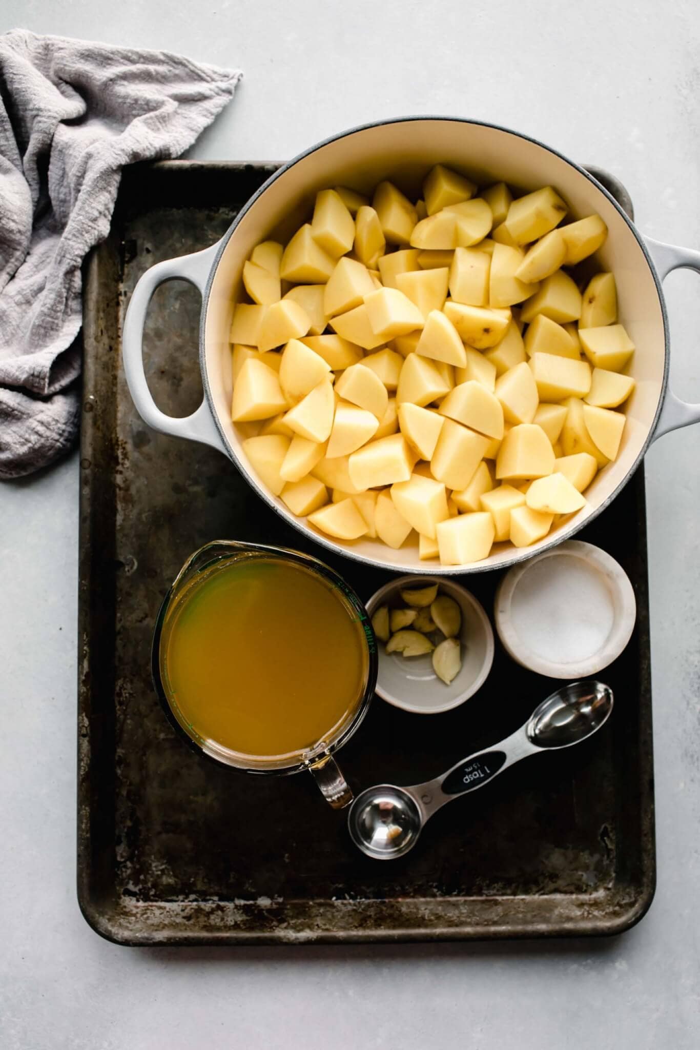 Ingredients for goat cheese potatoes on tray.