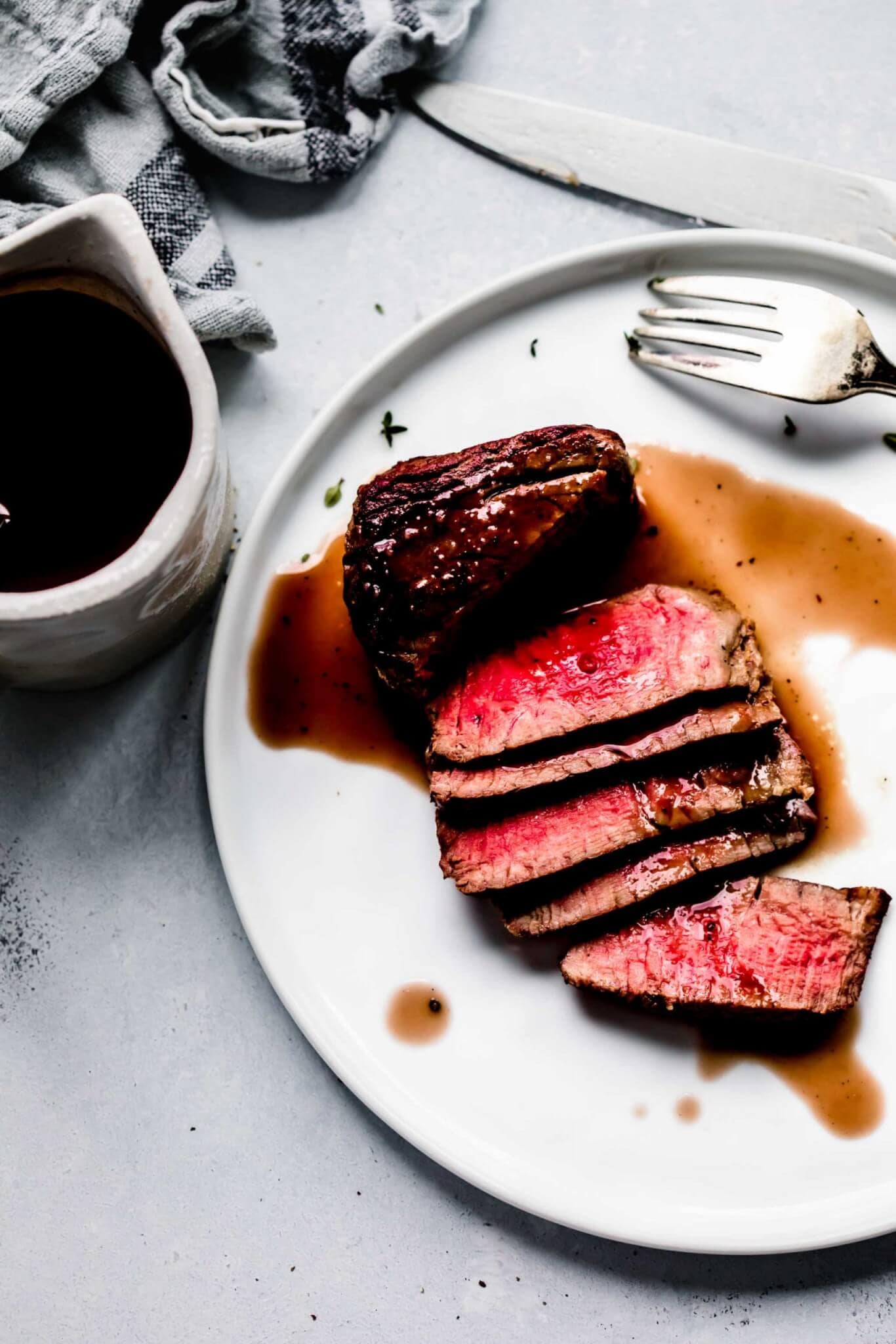 Steak drizzled with red wine jus.