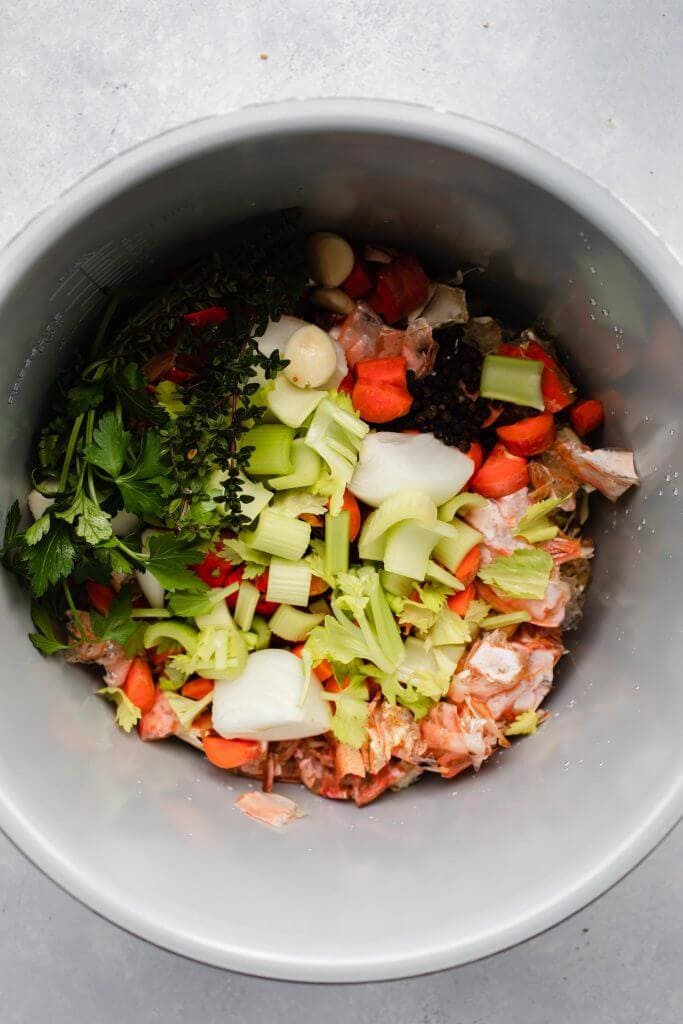 Seafood stock ingredients added to instant pot.