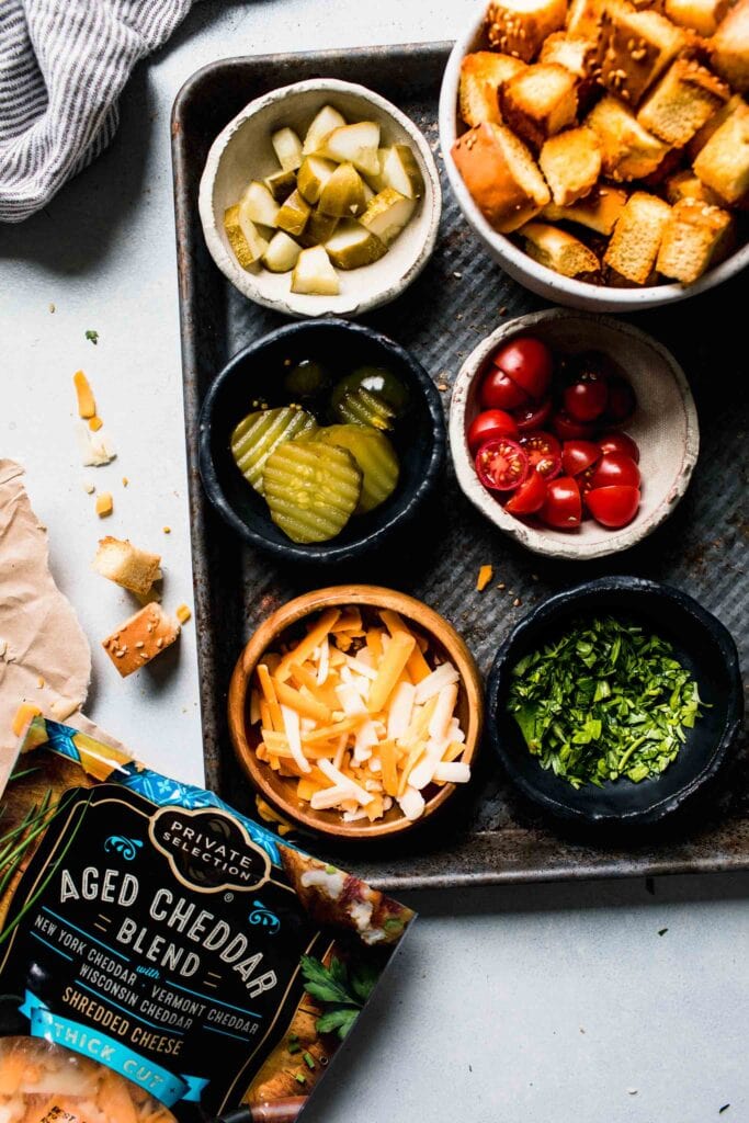 INGREDIENTS FOR CHEESEBURGER SOUP ON TRAY.