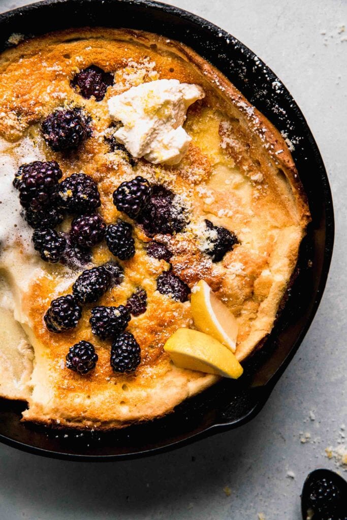 Dutch baby with scoop out of it.