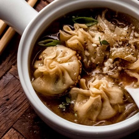 French onion soup dumplings in bowl.