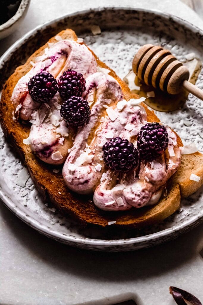 Side view of toast with whipped ricotta.
