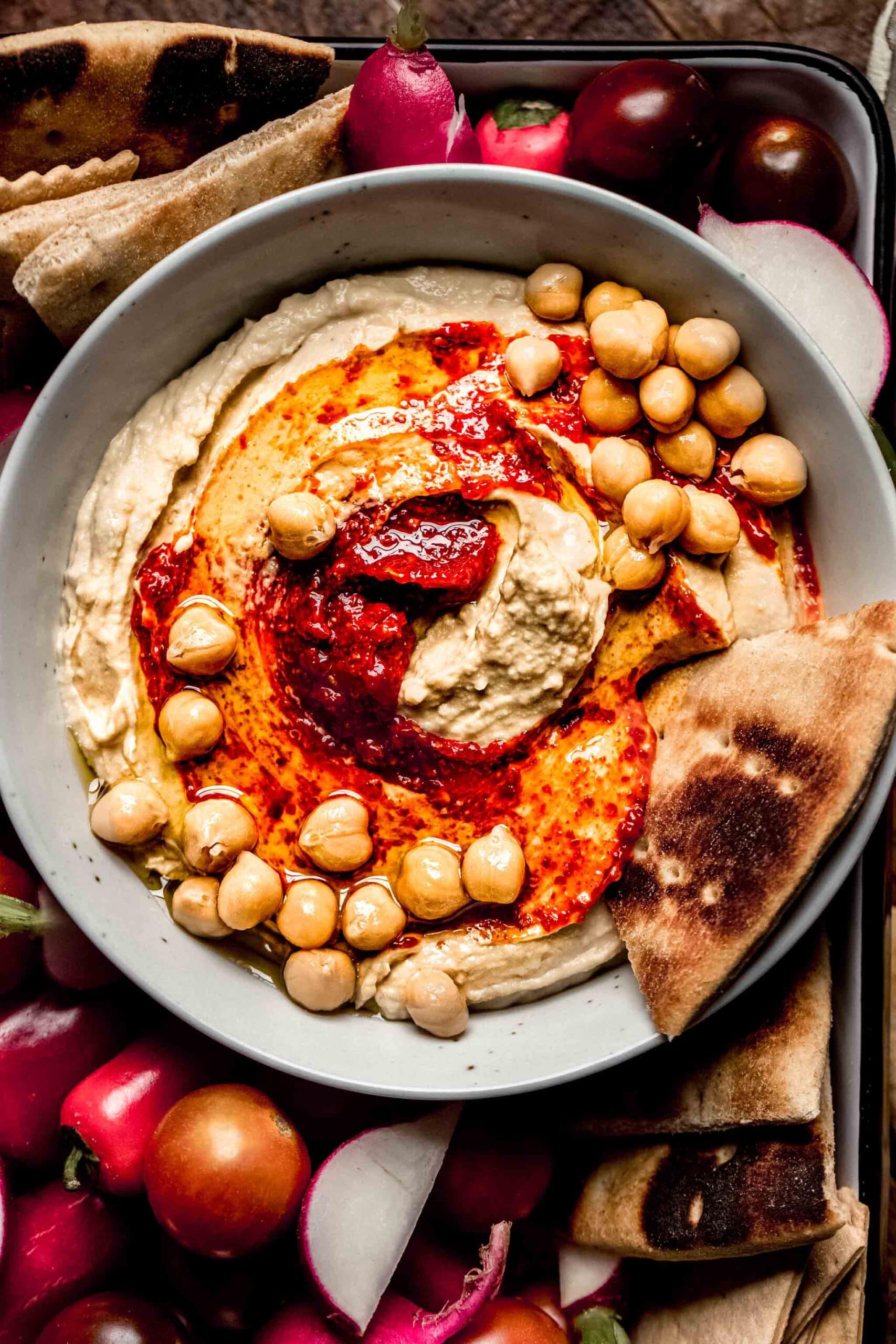 Overhead close up of bowl of harissa hummus.