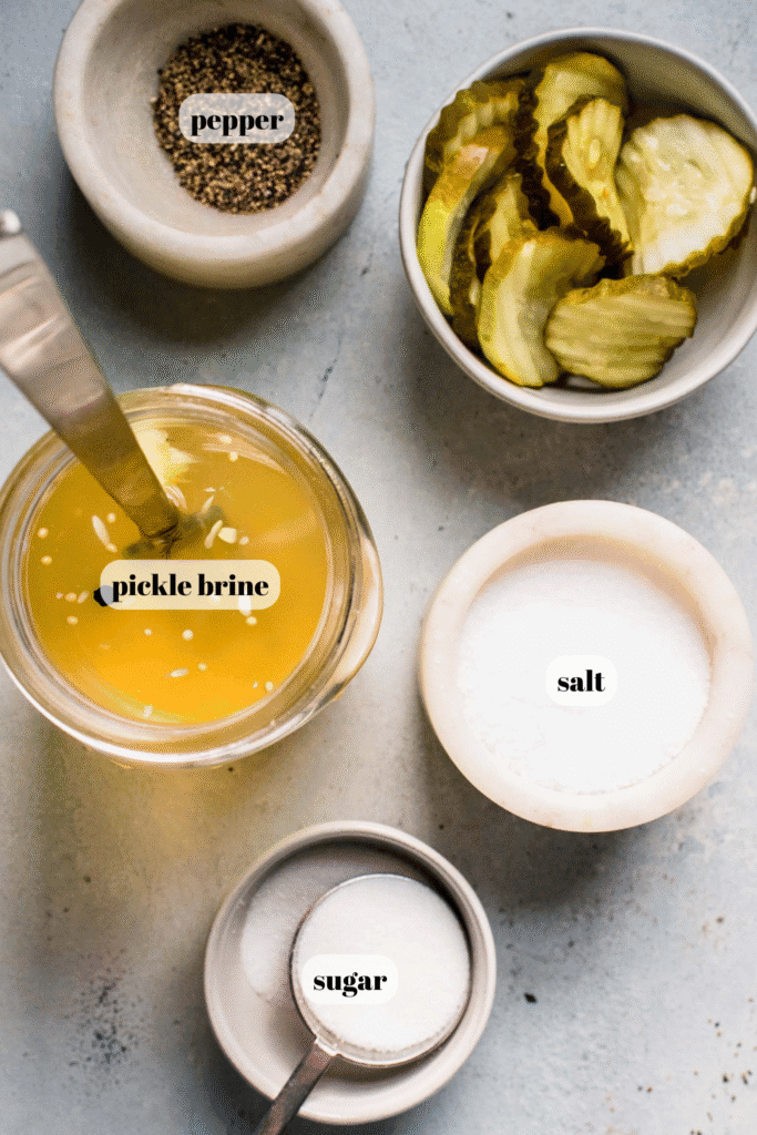 Ingredients for pickle juice brined chicken breasts labeled on counter.