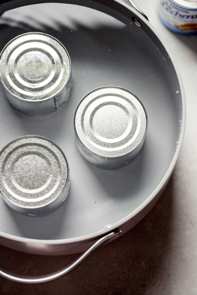 Cans in water.