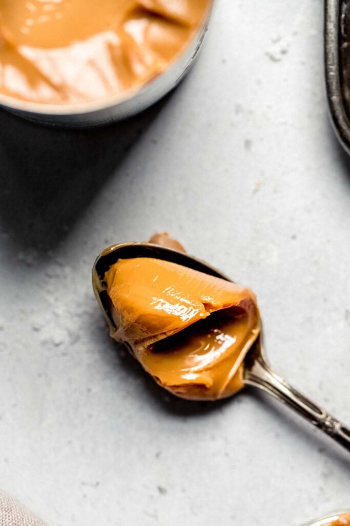 Dollop of dulce de leche on spoon.