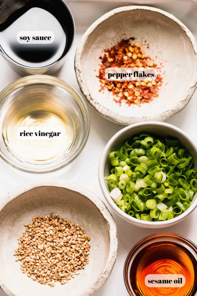 Gyoza sauce ingredients labeled on counter.