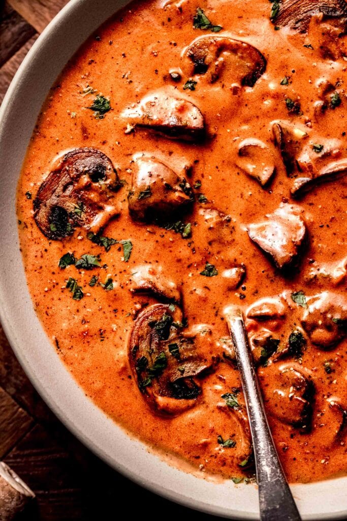 Jaeger sauce in bowl with spoon.