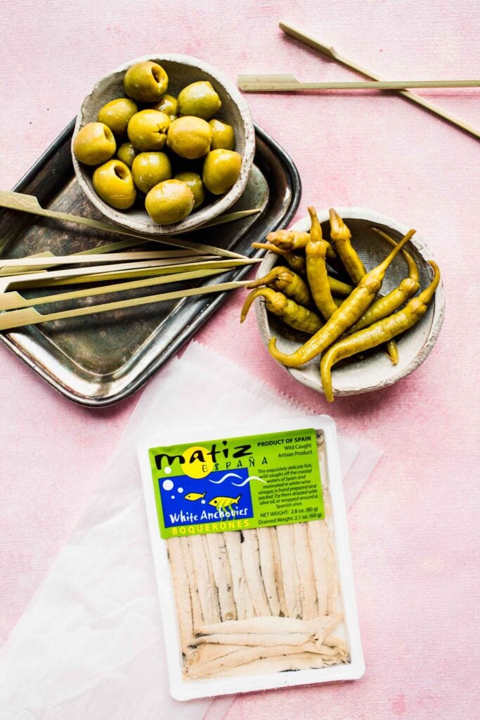 Ingredients for gilda pintxo on counter.