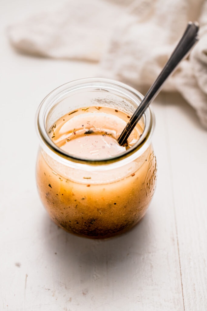 Dressing whisked together in jar.