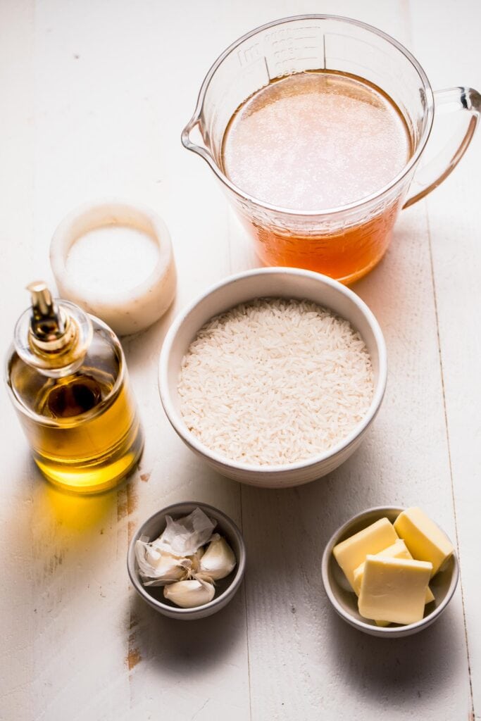 Ingredients for garlic rice on counter.